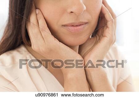 Woman touching her ears. View Large Photo Image Stock Image - Woman touching her ears.. Fotosearch