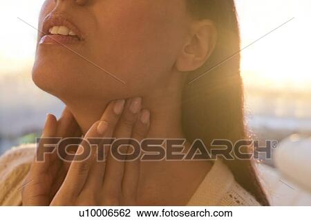Woman touching neck. View Large Photo Image Stock Image - Woman touching neck.. Fotosearch