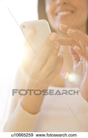 Woman using smartphone. View Large Photo Image Stock Photo - Woman using smartphone.. Fotosearch