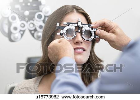 Woman wearing eyesight testing spectacles. View Large Photo Image Stock Image - Woman wearing eyesight testing spectacles.. Fotosearch