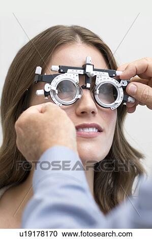 Stock Image - Woman wearing eyesight testing spectacles.. Fotosearch
