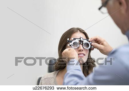 Stock Image - Woman wearing eyesight testing spectacles.. Fotosearch