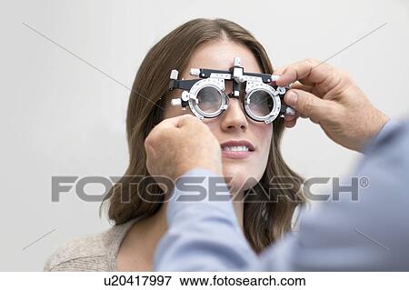 Woman wearing eyesight testing spectacles. View Large Photo Image Stock Photo - Woman wearing eyesight testing spectacles.. Fotosearch