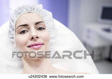 Woman wearing surgical cap in clinic. View Large Photo Image Stock Photo - Woman wearing surgical cap in clinic.. Fotosearch