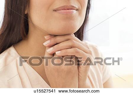 Woman with hands on chin. View Large Photo Image Stock Image - Woman with hands on chin.. Fotosearch
