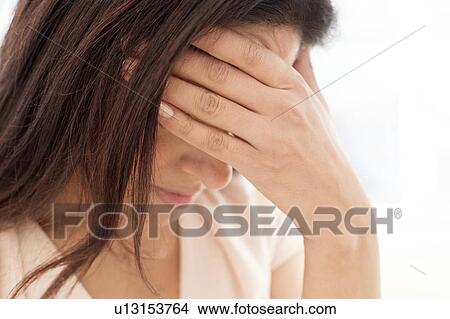 Woman with head in hand. View Large Photo Image Picture - Woman with head in hand.. Fotosearch