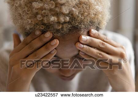 Woman with headache rubbing forehead View Large Photo Image Stock Photo - Woman with headache rubbing forehead. Fotosearch