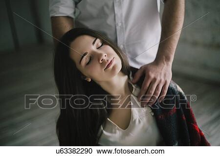 Woman with her eyes closed and man's hands on her shoulders View Large Photo Image Stock Image - Woman with her eyes closed and man's hands on her shoulders. Fotosearch