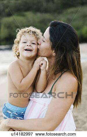 Woman with her son on beach View Large Photo Image Stock Photo - Woman with her son on beach. Fotosearch