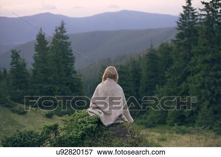 Woman wrapped in blanket in the Carpathian Mountain Range View Large Photo Image Stock Photo - Woman wrapped in blanket in the Carpathian Mountain Range. Fotosearch