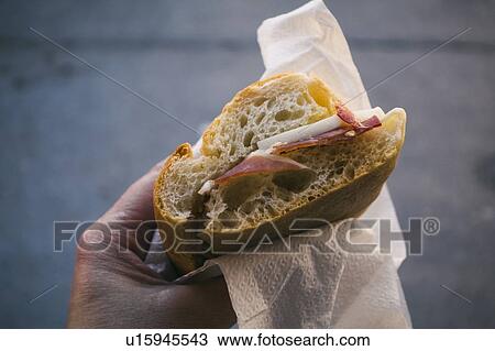 Woman's hand holding pancetta and cheese sandwich View Large Photo Image Stock Image - Woman's hand holding pancetta and cheese sandwich. Fotosearch