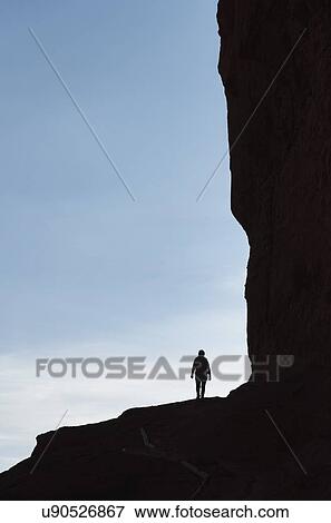 Stock Photo - Woman's silhouette by Fisher Towers in Utah, USA. Fotosearch