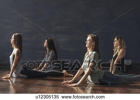 Women during yoga class View Large Photo Image Stock Photography - Women during yoga class. Fotosearch