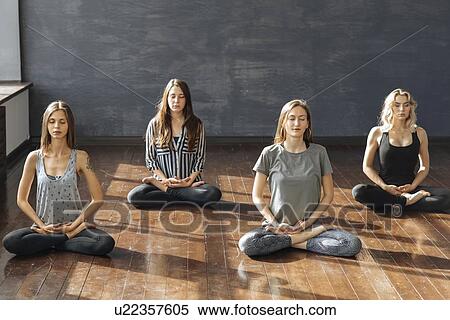 Stock Photography - Women meditating. Fotosearch