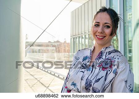 Young businesswoman outside office building, portrait, Turin, Piemonte, Italy View Large Photo Image Stock Image - Young businesswoman outside office building, portrait, Turin, Piemonte, Italy. Fotosearch