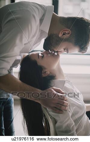 Young couple face to face with their eyes closed View Large Photo Image Stock Photograph - Young couple face to face with their eyes closed. Fotosearch