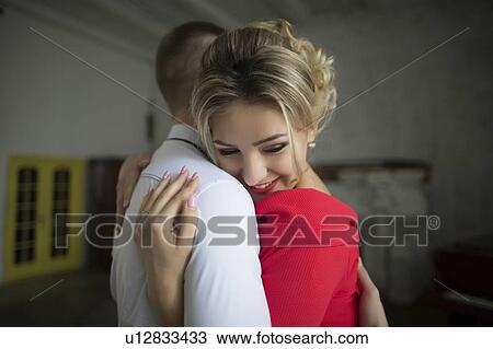 Stock Image - Young couple hugging. Fotosearch