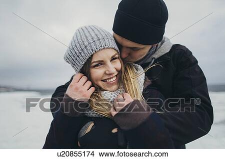Young couple wearing warm clothing View Large Photo Image Picture - Young couple wearing warm clothing. Fotosearch