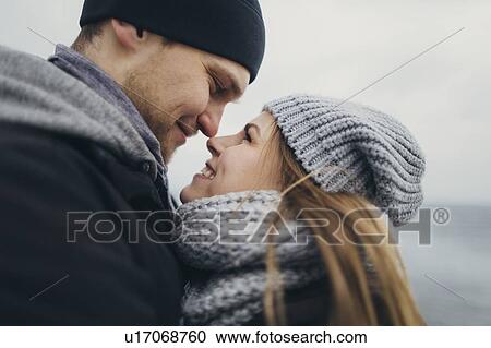 Stock Image - Young couple wearing warm clothing. Fotosearch