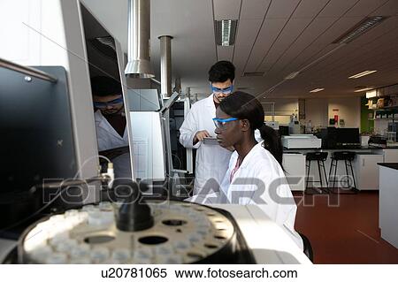 Young female and male scientists using computer and digital tablet in laboratory View Large Photo Image Stock Photography - Young female and male scientists using computer and digital tablet in laboratory. Fotosearch