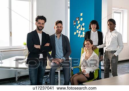 Young male and female business creative team in open plan office, portrait View Large Photo Image Stock Image - Young male and female business creative team in open plan office, portrait. Fotosearch