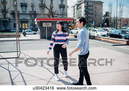 Young man and woman on city basketball court View Large Photo Image Stock Photograph - Young man and woman on city basketball court. Fotosearch