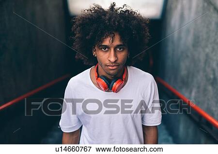 Young man ascending stairway View Large Photo Image Stock Photo - Young man ascending stairway. Fotosearch