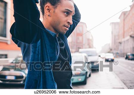 Young man exploring city, Milano, Lombardia, Italy View Large Photo Image Stock Photograph - Young man exploring city, Milano, Lombardia, Italy. Fotosearch