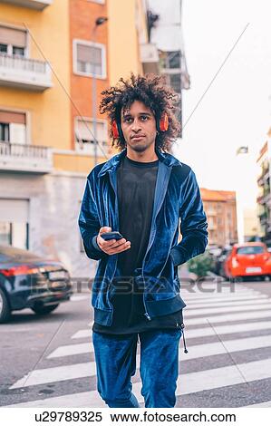 Young man exploring city, Milano, Lombardia, Italy View Large Photo Image Stock Photography - Young man exploring city, Milano, Lombardia, Italy. Fotosearch