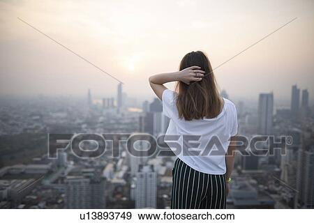 Young woman and cityscape of Bangkok, Thailand View Large Photo Image Stock Photo - Young woman and cityscape of Bangkok, Thailand. Fotosearch