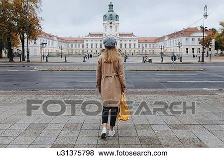 Stock Photo - Young woman by Charlottenburg Palace. Fotosearch