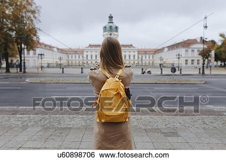Stock Photograph - Young woman by Charlottenburg Palace. Fotosearch