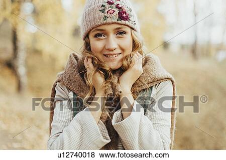 Young woman in floral pattern woolen hat View Large Photo Image Stock Photo - Young woman in floral pattern woolen hat. Fotosearch