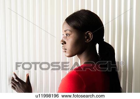 Young woman in red tshirt, head and shoulder profile portrait View Large Photo Image Stock Photograph - Young woman in red tshirt, head and shoulder profile portrait. Fotosearch