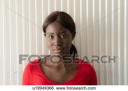 Young woman in red tshirt, head and shoulder portrait View Large Photo Image Stock Photograph - Young woman in red tshirt, head and shoulder portrait. Fotosearch