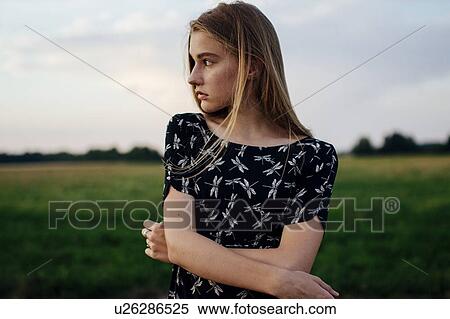 Stock Photography - Young woman on farm. Fotosearch