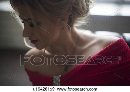 Stock Photo - Young woman wearing red lipstick. Fotosearch