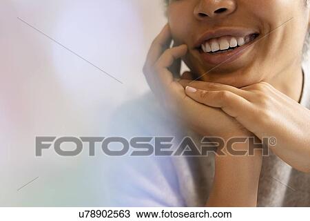 Young woman with hands clasped View Large Photo Image Stock Image - Young woman with hands clasped. Fotosearch