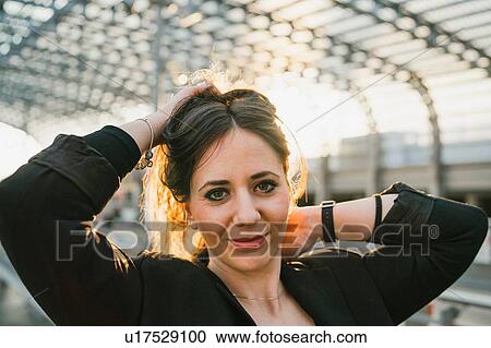 Young woman with hands in hair in train station, portrait, Turin, Piemonte, Italy View Large Photo Image Stock Image - Young woman with hands in hair in train station, portrait, Turin, Piemonte, Italy. Fotosearch