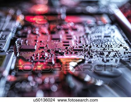 Picture - Computer hardware. Interior of a laptop computer showing chips, circuit boards and components.. Fotosearch