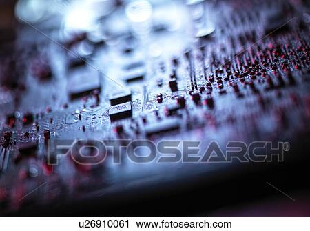 Stock Image - Computer hardware. Interior of a laptop computer showing chips, circuit boards and components.. Fotosearch