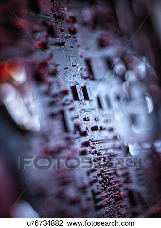 Stock Image - Computer hardware. Interior of a laptop computer showing chips, circuit boards and components.. Fotosearch