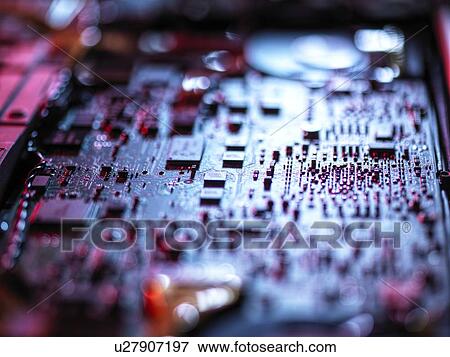 Stock Photo - Computer hardware. Interior of a laptop computer showing chips, circuit boards and components.. Fotosearch