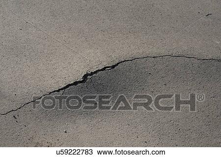 Cracked asphalt. View Large Photo Image Stock Image - Cracked asphalt.. Fotosearch