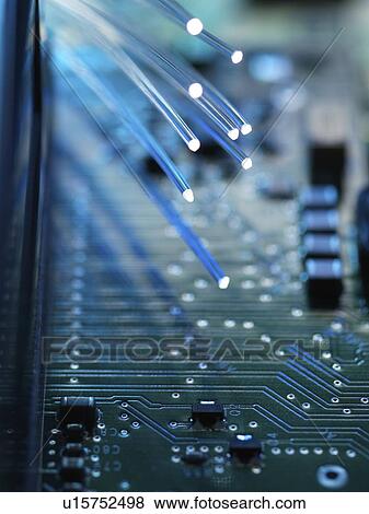 Digital communication, conceptual image. Fibre optics carrying data passing across a computer's motherboard. View Large Photo Image Stock Photo - Digital communication, conceptual image. Fibre optics carrying data passing across a computer's motherboard.. Fotosearch