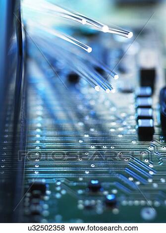 Stock Photo - Digital communication, conceptual image. Fibre optics carrying data passing across a computer's motherboard.. Fotosearch