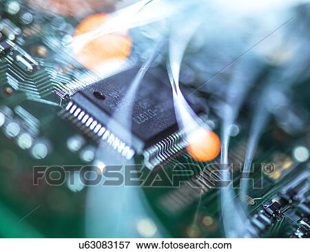Digital communication, conceptual image. Fibre optics carrying data over electronic circuitry on a laptop computer. View Large Photo Image Stock Photo - Digital communication, conceptual image. Fibre optics carrying data over electronic circuitry on a laptop computer.. Fotosearch
