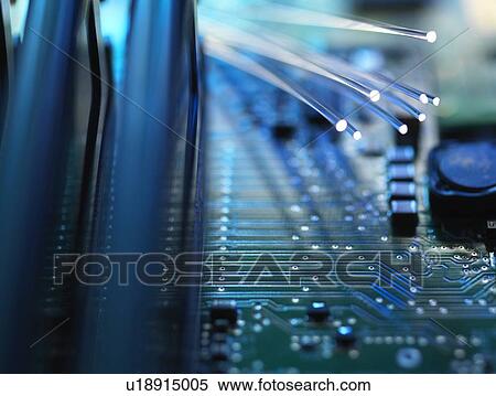 Stock Photography - Digital communication, conceptual image. Fibre optics carrying data passing across a computer's motherboard.. Fotosearch