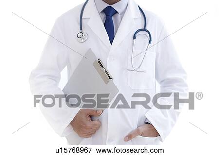 Doctor holding clipboard, close-up. View Large Photo Image Stock Photo - Doctor holding clipboard, close-up.. Fotosearch