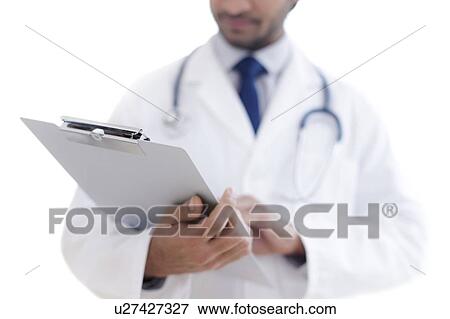 Doctor holding clipboard, close-up. View Large Photo Image Stock Photo - Doctor holding clipboard, close-up.. Fotosearch